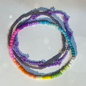 A Trio of Stacking Bead Lilac/Plum/multi-color Bracelets